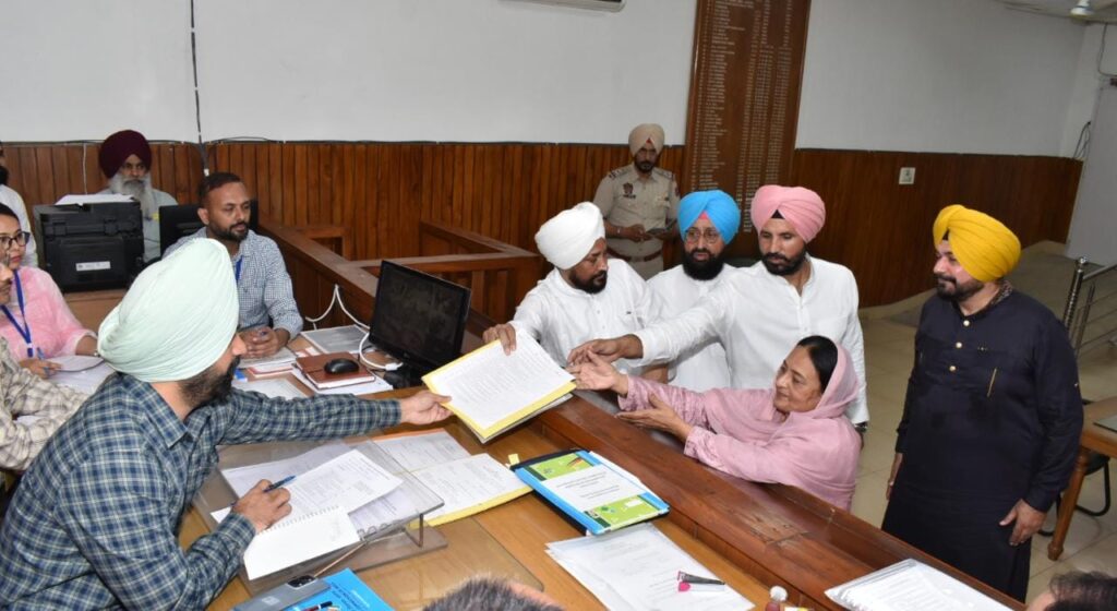 WhatsApp-Image-2023-04-13-at-1.34.06-PM-1024x560 Caption: Jalandhar Lok Sabha Bypoll: Deputy Commissioner-cum-Returning Officer for 04-Jalandhar (SC) Parliamentary Constituency Jaspreet Singh receiving nominations of Indian National Congress Candidate Karamjit Kaur at DAC on Thursday.